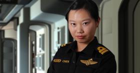 Lieutenant standing in starship corridor